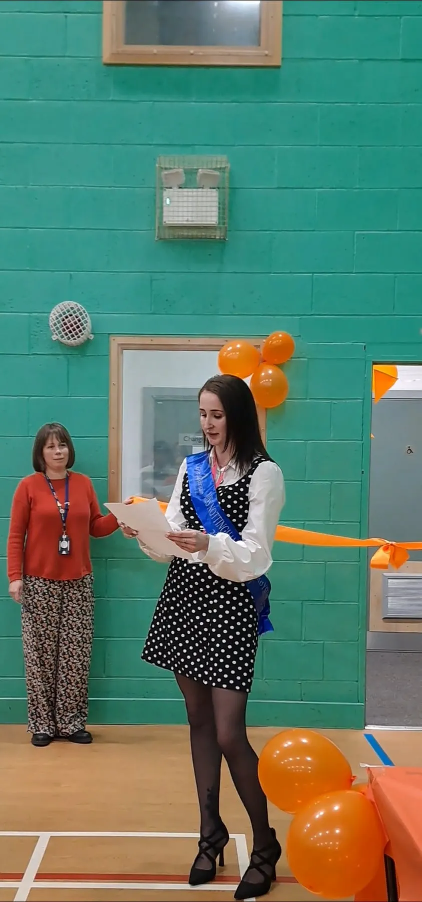 Emma speaking at an event